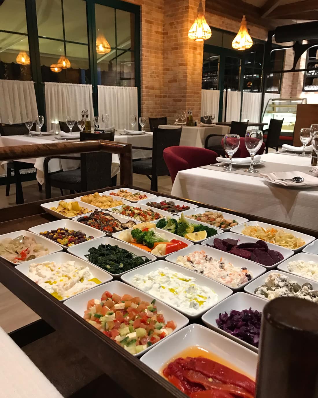 The dining room with a spread of meze